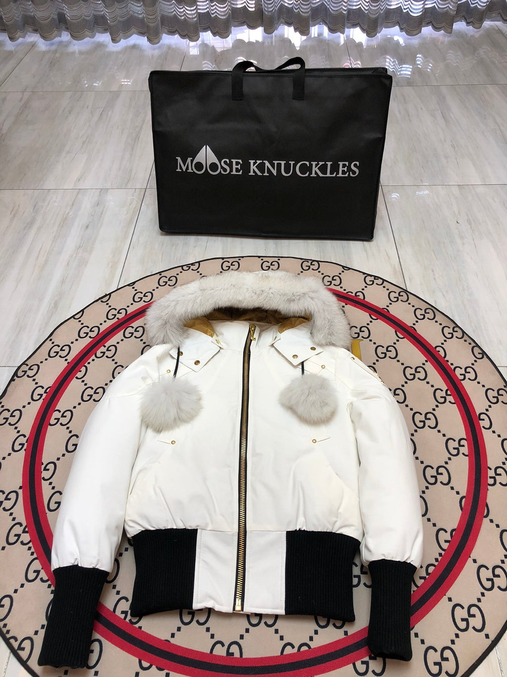 Moose Knuckles Women's White Bomber Jacket with Pom-Pom Hood