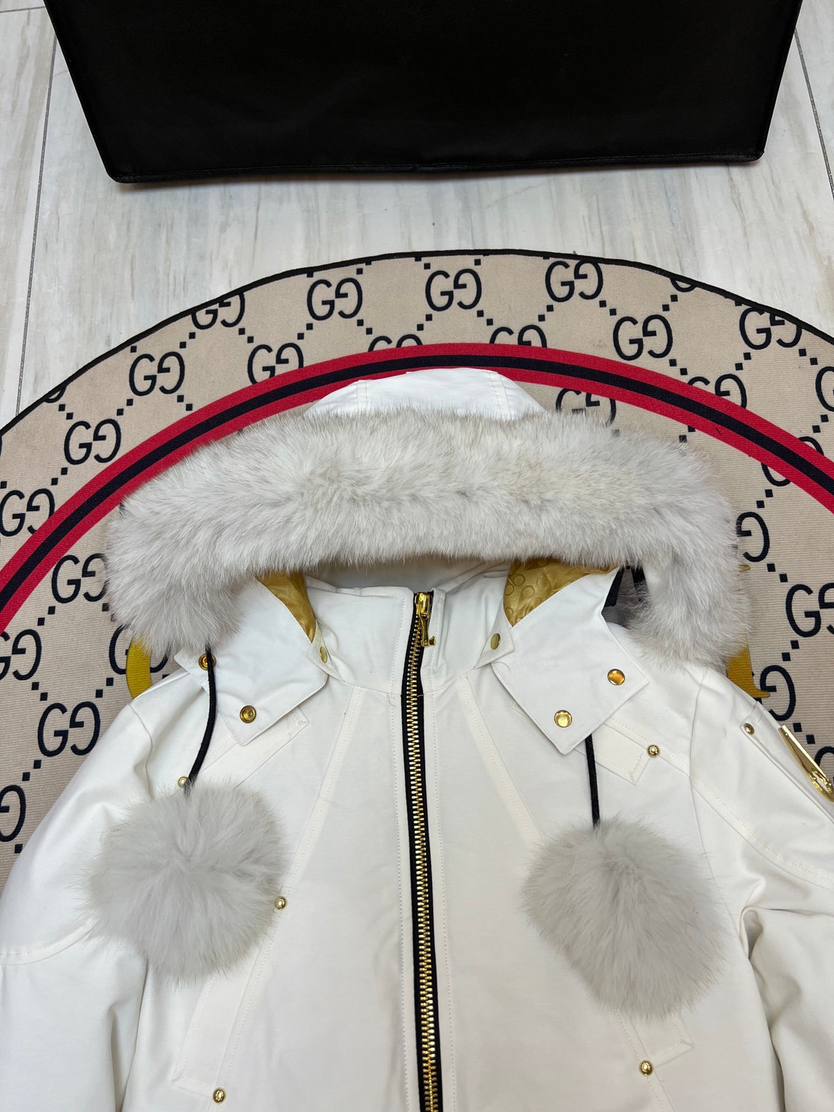 Moose Knuckles Women's White Bomber Jacket with Pom-Pom Hood