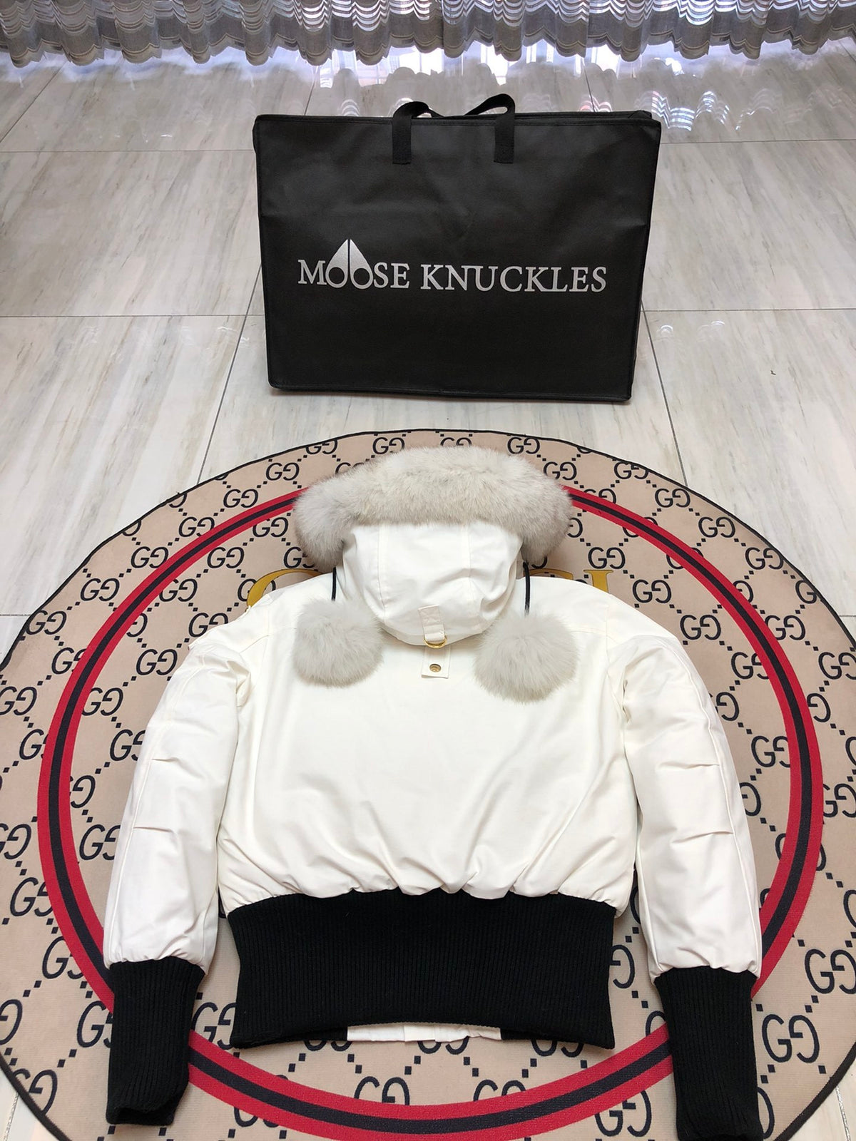 Moose Knuckles Women's White Bomber Jacket with Pom-Pom Hood